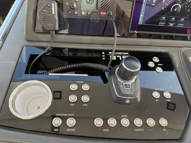 Slide: The Image of Control panel of a 2025 Schaefer 375 yacht with navigation and communication equipment. - 9