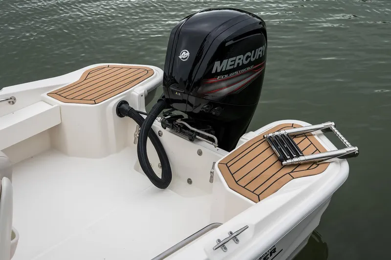 Slide: The Image of Manufacturer Provided Image: 2025 Boston Whaler 160 Super Sport with Mercury engine, featuring teak accents and swim ladder. - 15