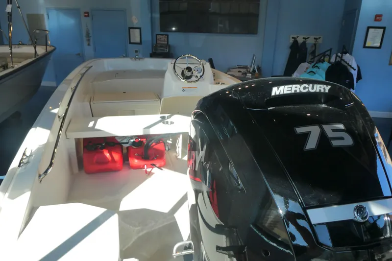 Slide: The Image of 2025 Boston Whaler 160 Super Sport with Mercury 75 engine in showroom. - 4