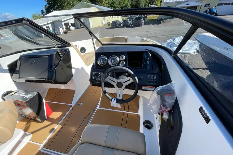 Slide: The Image of 2026 Bayliner V20i boat interior with modern dashboard and steering wheel. - 7