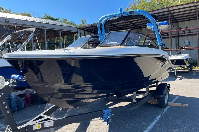 Slide: The Image of 2026 Bayliner V20i boat on trailer in outdoor storage area. - 8