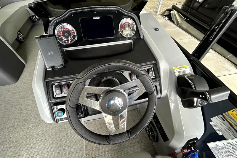 Slide: The Image of Interior of 2025 Godfrey Monaco 255 DFL pontoon boat with luxurious seating and helm. - 14