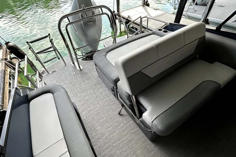 Slide: The Image of 2025 Godfrey Monaco 255 DFL pontoon boat interior with luxurious seating and modern design. - 17