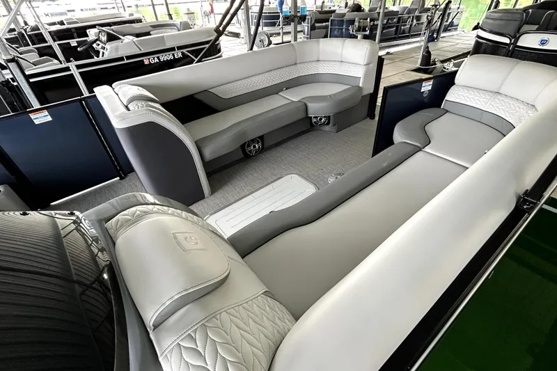 Slide: The Image of Luxurious interior of 2025 Godfrey Monaco 255 DFL pontoon boat with plush seating. - 18