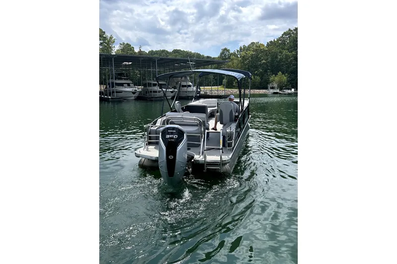 Slide: The Image of 2025 Godfrey Monaco 255 DFL pontoon boat interior with spacious seating and canopy. - 6