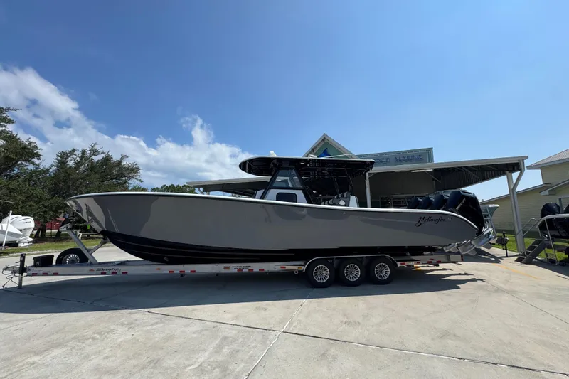 The Image of 2026 Yellowfin 39 Offshore boat on trailer under clear blue sky. - 1