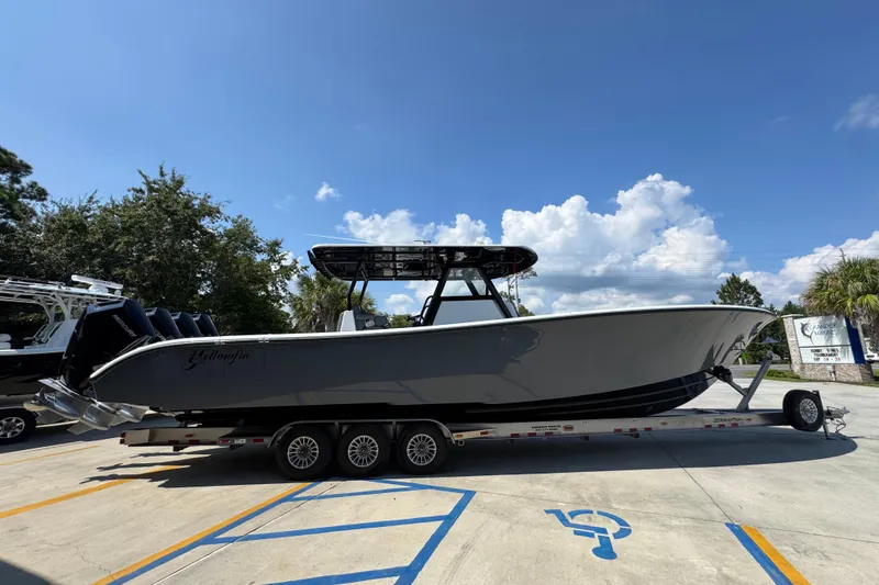 Slide: The Image of 2026 Yellowfin 39 Offshore boat on trailer under clear blue sky. - 10