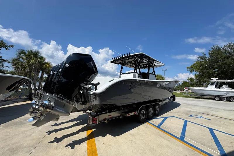 Slide: The Image of 2026 Yellowfin 39 Offshore boat on trailer under clear blue sky. - 12