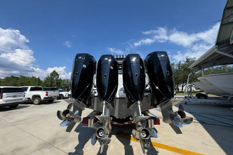 Slide: The Image of 2026 Yellowfin 39 Offshore boat with four powerful outboard engines, parked outdoors. - 15