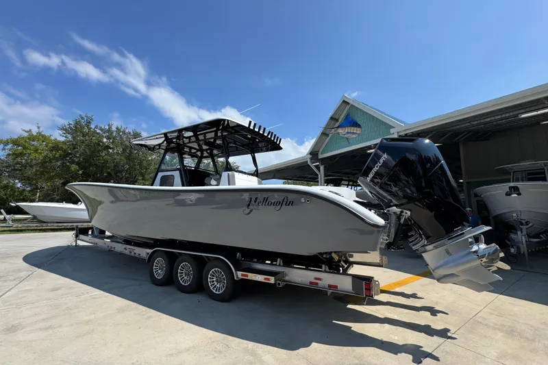 Slide: The Image of 2026 Yellowfin 39 Offshore boat on trailer, parked outdoors under clear sky. - 18