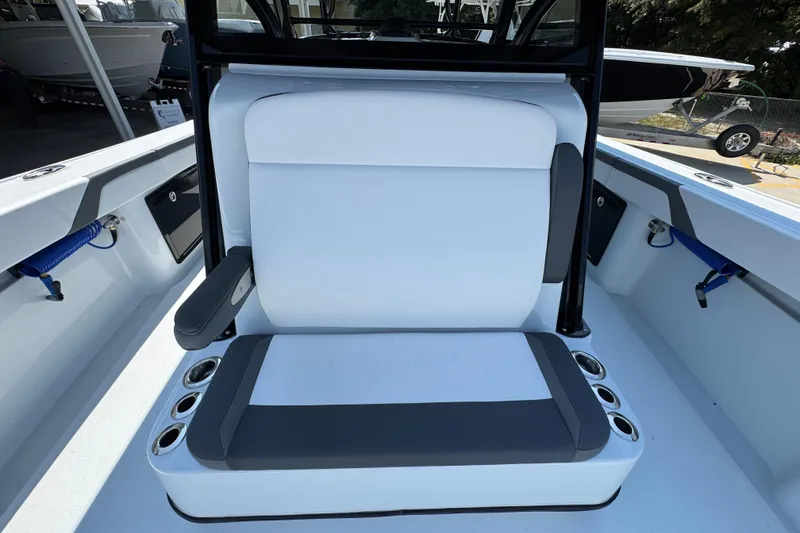 Slide: The Image of 2026 Yellowfin 39 Offshore boat seating with cup holders and armrest. - 28