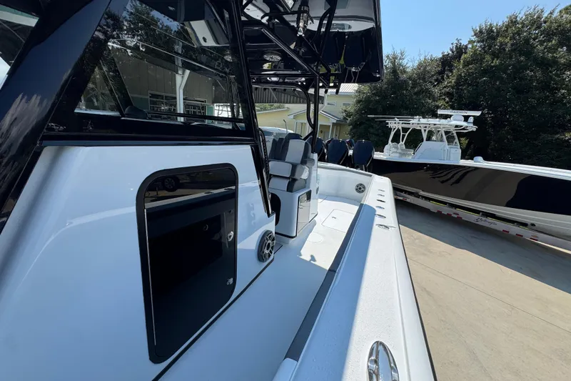 Slide: The Image of 2026 Yellowfin 39 Offshore boat, sleek design, docked outdoors, showcasing modern features. - 29