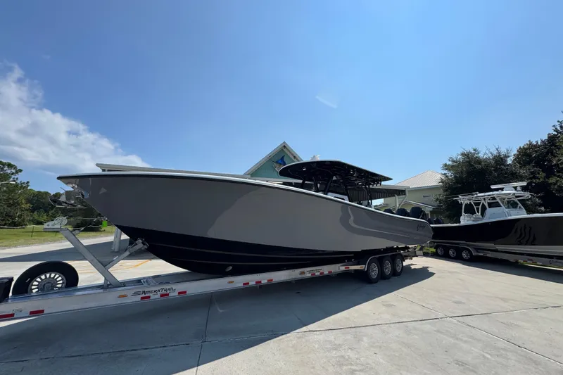 Slide: The Image of 2026 Yellowfin 39 Offshore boat on trailer under clear blue sky. - 3