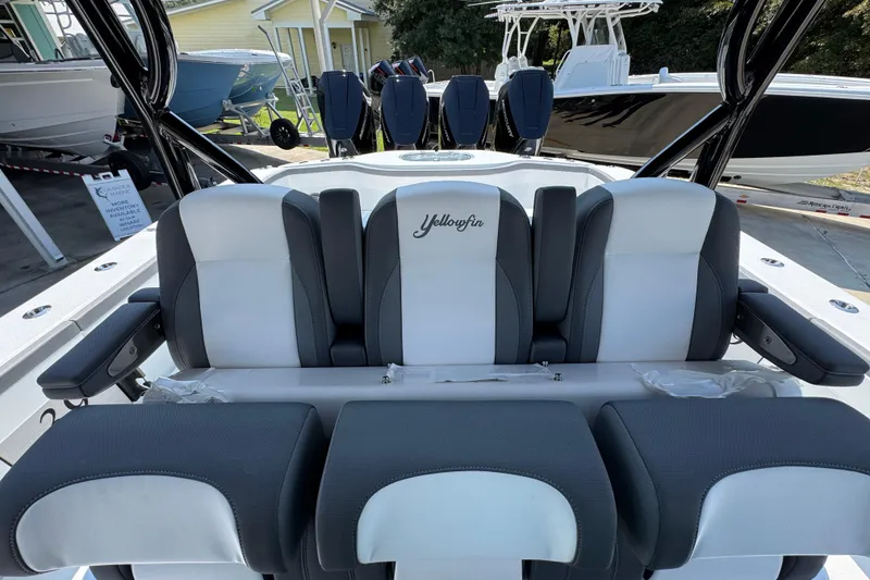 Slide: The Image of 2026 Yellowfin 39 Offshore boat seating, featuring sleek black and white design. - 32
