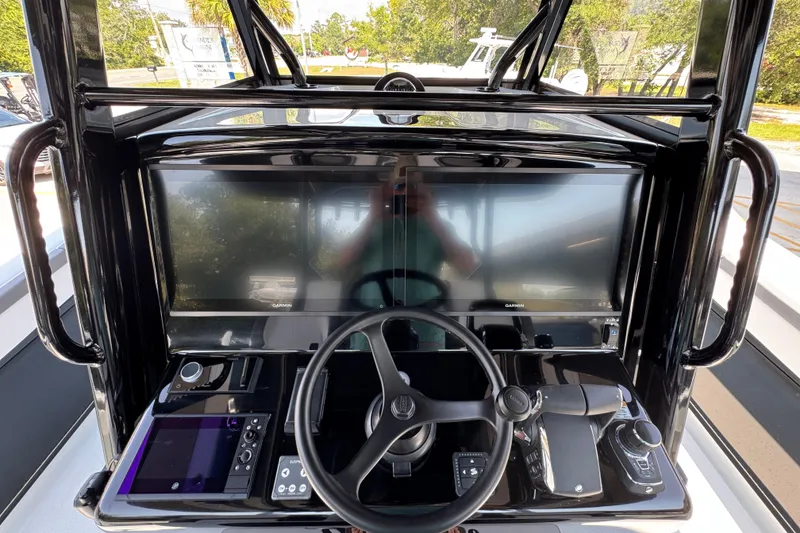 Slide: The Image of 2026 Yellowfin 39 Offshore boat dashboard with advanced navigation systems and controls. - 35