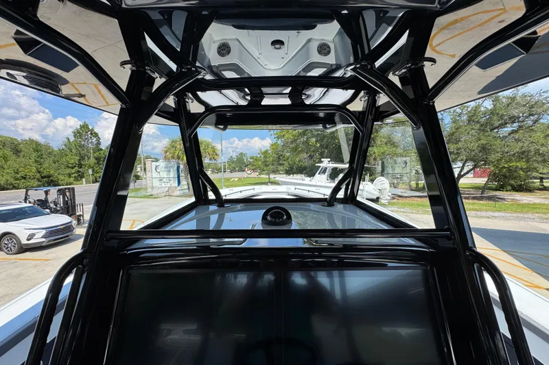Slide: The Image of 2026 Yellowfin 39 Offshore boat interior with sleek black framework and outdoor view. - 36