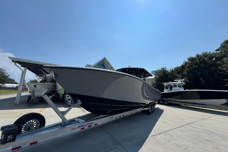 Slide: The Image of 2026 Yellowfin 39 Offshore boat on trailer under clear blue sky. - 4