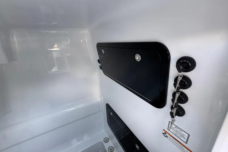 Slide: The Image of 2026 Yellowfin 39 Offshore interior with control panel and storage compartment. - 42