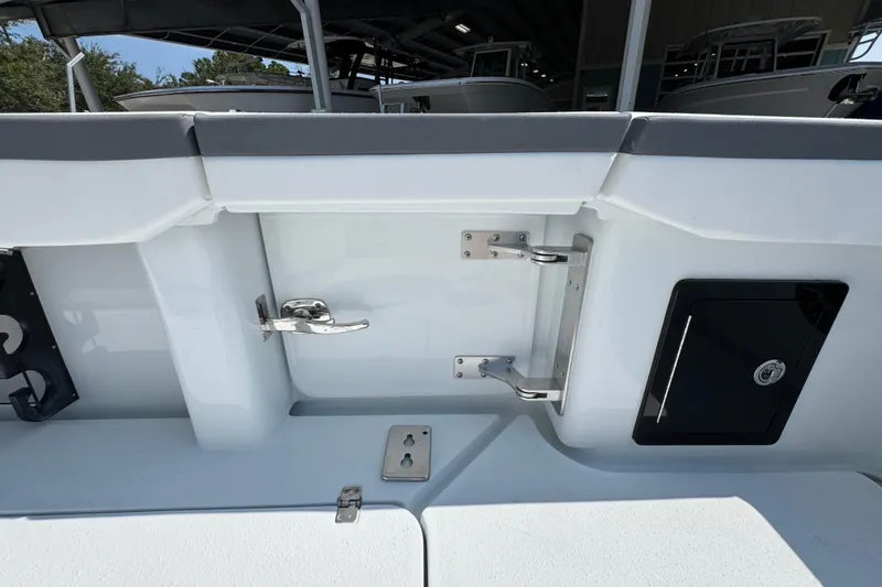 Slide: The Image of 2026 Yellowfin 39 Offshore boat interior, featuring stainless steel hardware and storage compartment. - 45