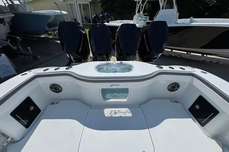Slide: The Image of 2026 Yellowfin 39 Offshore boat with four Mercury engines, docked in a marina. - 47