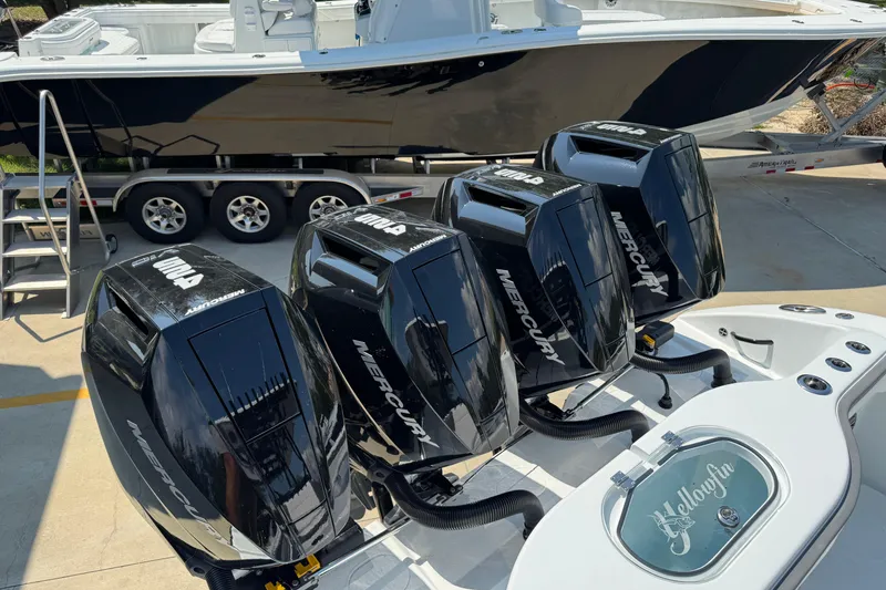 Slide: The Image of 2026 Yellowfin 39 Offshore boat with four powerful Mercury outboard engines. - 49