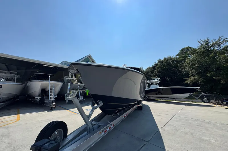 Slide: The Image of 2026 Yellowfin 39 Offshore boat on trailer in sunny outdoor setting. - 5