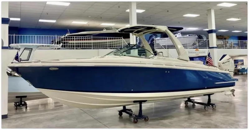 Slide: The Image of 2021 Chris-Craft 28 LAUNCH GT boat in showroom, side view. - 2
