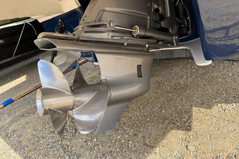 Slide: The Image of 2019 Regal 28 Express boat propeller on gravel surface. - 28