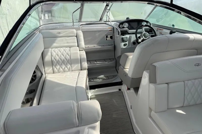 Slide: The Image of Luxurious interior of 2019 Regal 28 Express boat with plush seating and modern dashboard. - 29