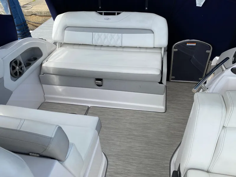 Slide: The Image of 2019 Regal 28 Express boat interior with white seating and modern design. - 5