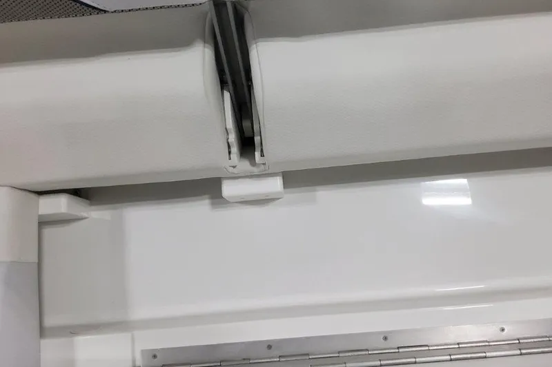 Slide: The Image of 2026 Formula 310 Bowrider interior detail, showcasing sleek white upholstery and modern design elements. - 101