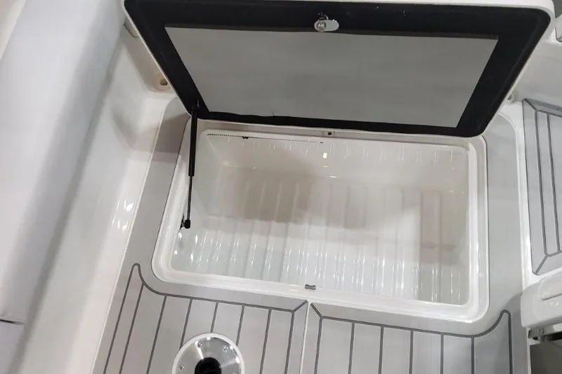 Slide: The Image of Open storage compartment on 2026 Formula 310 Bowrider boat deck. - 105