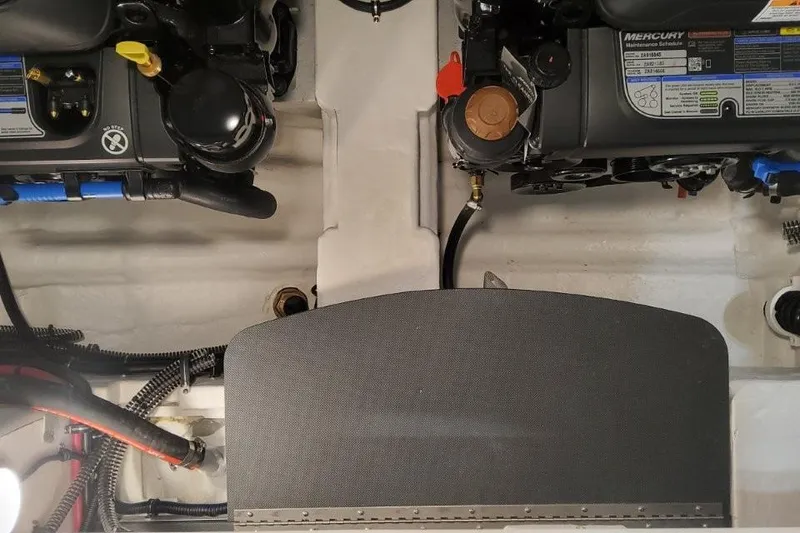 Slide: The Image of Engine compartment of a 2026 Formula 310 Bowrider boat, showcasing dual Mercury engines. - 113