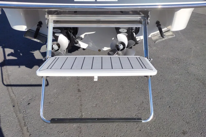 Slide: The Image of Steering wheel and dashboard of 2026 Formula 310 Bowrider boat with gauges and controls. - 13