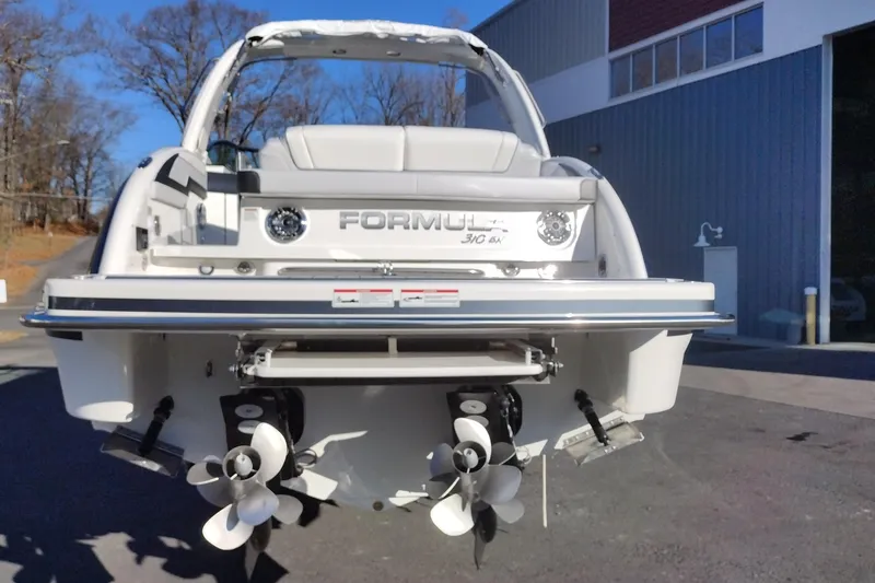 Slide: The Image of 2026 Formula 310 Bowrider dashboard with steering wheel, gauges, and controls. - 14