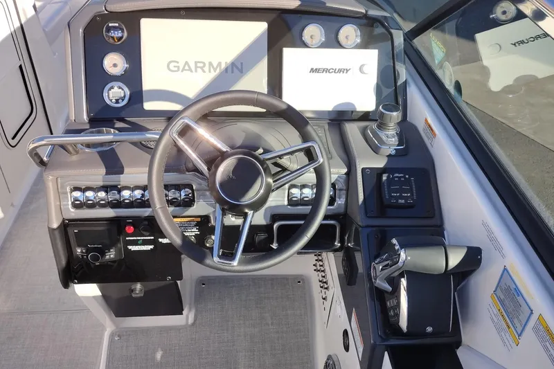 Slide: The Image of 2026 Formula 310 Bowrider interior with luxurious white seating and modern steering wheel. - 24