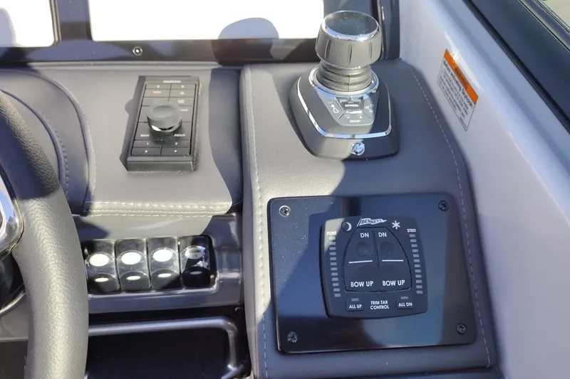 Slide: The Image of 2026 Formula 310 Bowrider boat with sleek white seating and integrated cup holders. - 28