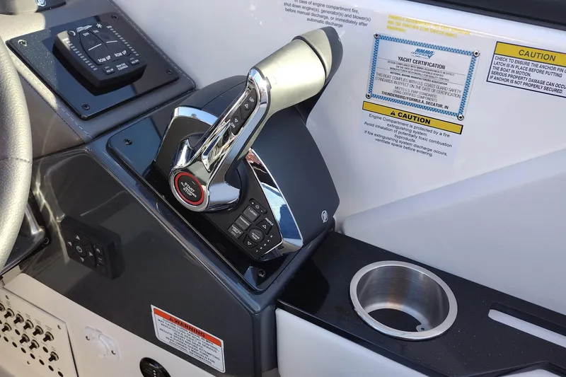 Slide: The Image of 2026 Formula 310 Bowrider boat interior with sleek white seating and cup holders. - 29