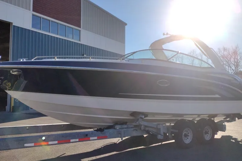 Slide: The Image of 2026 Formula 310 Bowrider boat on trailer in snowy outdoor setting. - 3