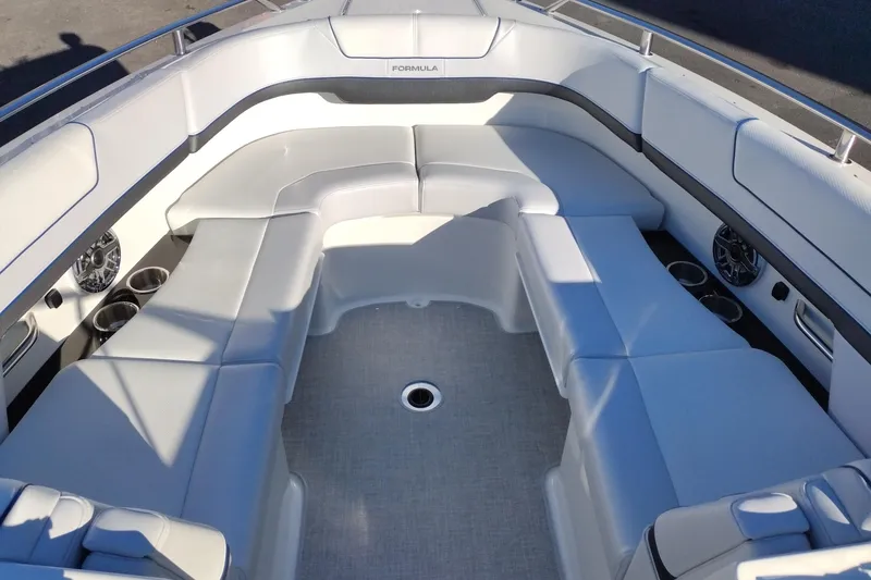 Slide: The Image of 2026 Formula 310 Bowrider interior with sleek white seating and cup holders. - 31