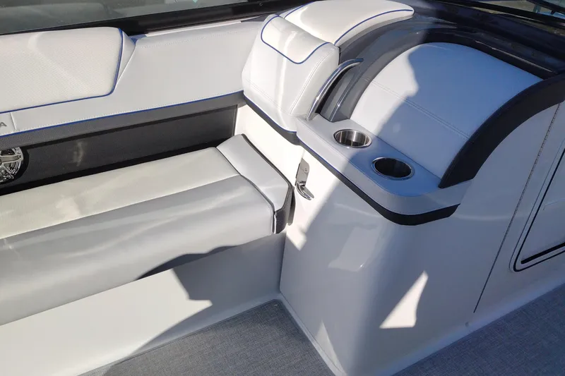 Slide: The Image of 2026 Formula 310 Bowrider boat dashboard with controls and stereo system. - 35