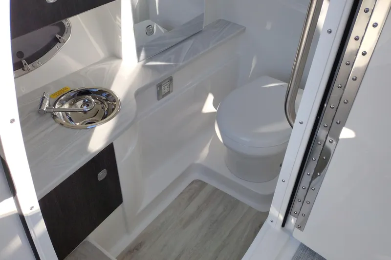 Slide: The Image of 2026 Formula 310 Bowrider boat in a showroom, showcasing sleek design and modern features. - 36