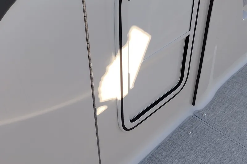 Slide: The Image of 2026 Formula 310 Bowrider boat with sleek blue and white design in a showroom. - 39