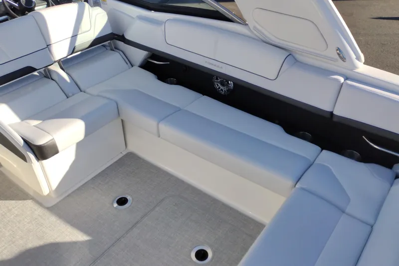 Slide: The Image of 2026 Formula 310 Bowrider boat in a showroom, showcasing sleek design and modern features. - 40