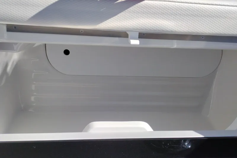 Slide: The Image of 2026 Formula 310 Bowrider boat in a showroom, featuring sleek blue and white design. - 42