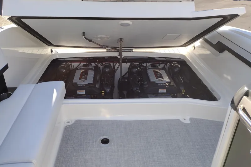 Slide: The Image of 2026 Formula 310 Bowrider boat in a manufacturing facility, rear view. - 46