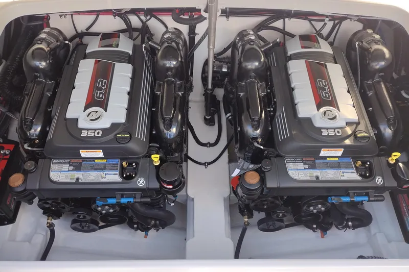 Slide: The Image of 2026 Formula 310 Bowrider boat interior in a spacious warehouse setting. - 49