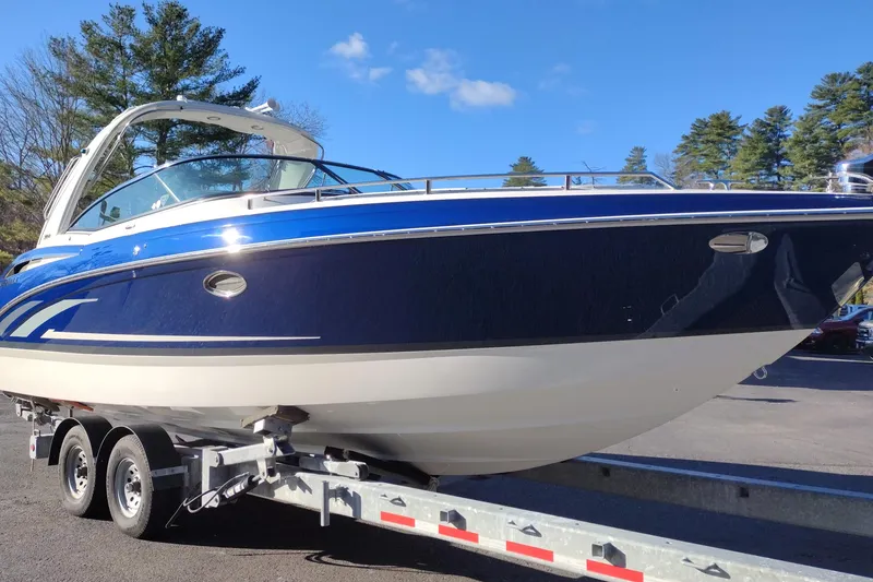 Slide: The Image of 2026 Formula 310 Bowrider boat on trailer, snowy outdoor setting. - 5