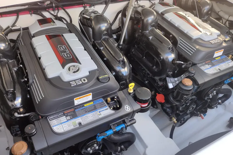 Slide: The Image of 2026 Formula 310 Bowrider interior with seating and cup holder, docked in a workshop. - 50