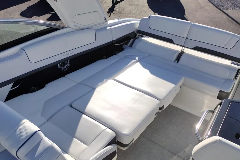 Slide: The Image of 2026 Formula 310 Bowrider anchor compartment with winch and chain storage. - 56